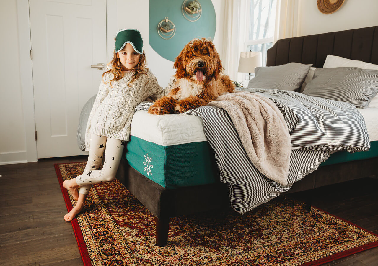 girl and dog on zinus mattress and charlotte bed frame