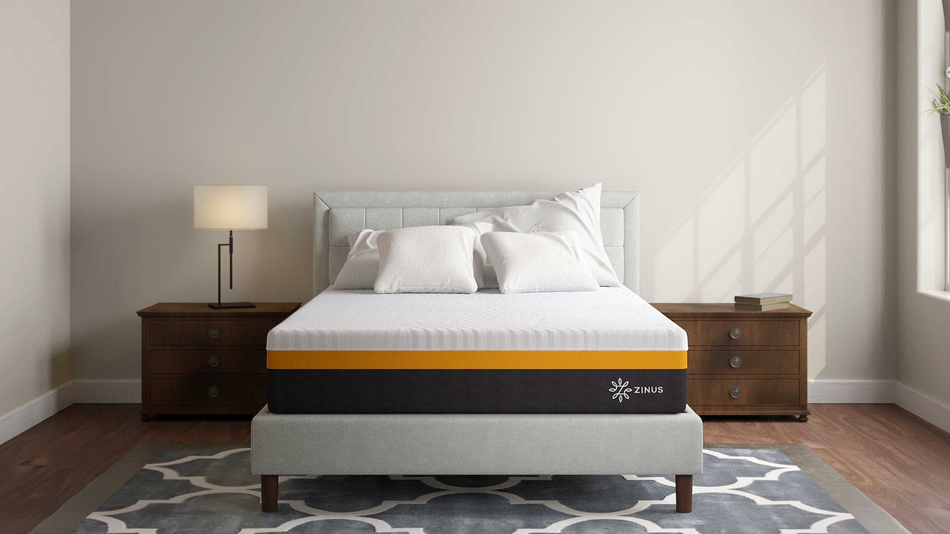 Modern bedroom with a Zinus mattress featuring a white top and gold accent band on a light gray upholstered bed, styled with neutral pillows, wood nightstands, and soft lighting to highlight clean, supportive design.