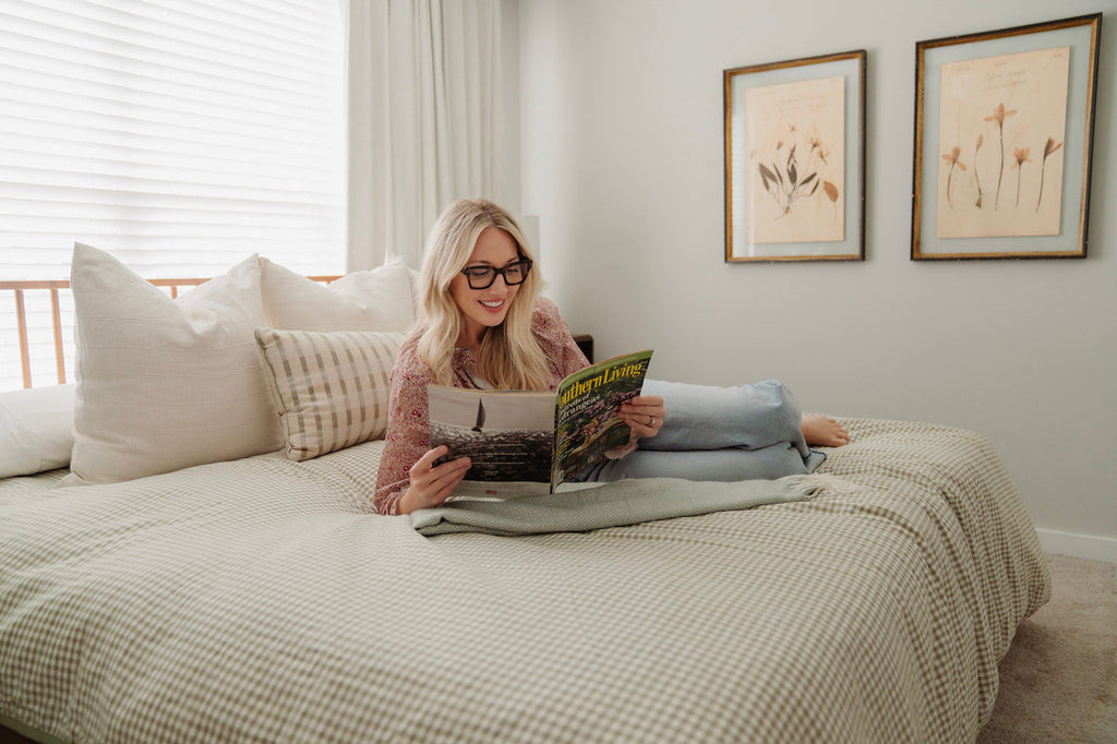 Happy woman hugging Zinus Ultra Cooling Green Tea Hybrid Mattress on Linda Platform Bed Frame, highlighting contouring comfort and cool sleep support