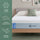 Zinus Balanced Comfort Signature Memory Foam Mattress on an upholstered platform bed in a bright bedroom with white and green pillows, highlighting three benefits: cooling comfort, targeted pressure relief, and all-night freshness for cool, restful sleep.