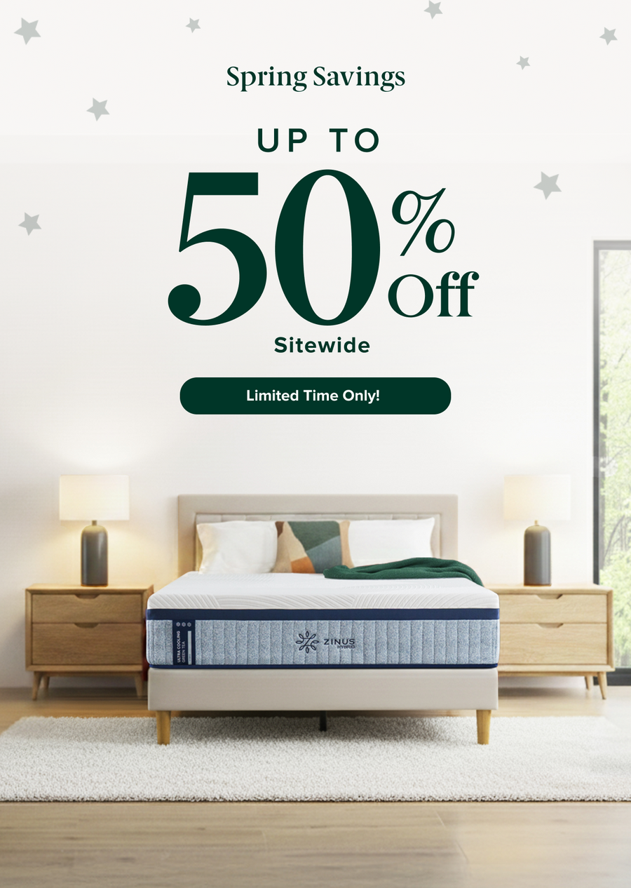 Spring savings sale offers up to 50% off sitewide for a limited time, featuring a Zinus mattress on a modern upholstered bed with wood legs, styled in a bright bedroom with matching nightstands, lamps, and a neutral rug for a clean, comfortable sleep setup