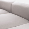 Detailed view of the Luca Double Chaise Sectional Sofa's beige fabric upholstery