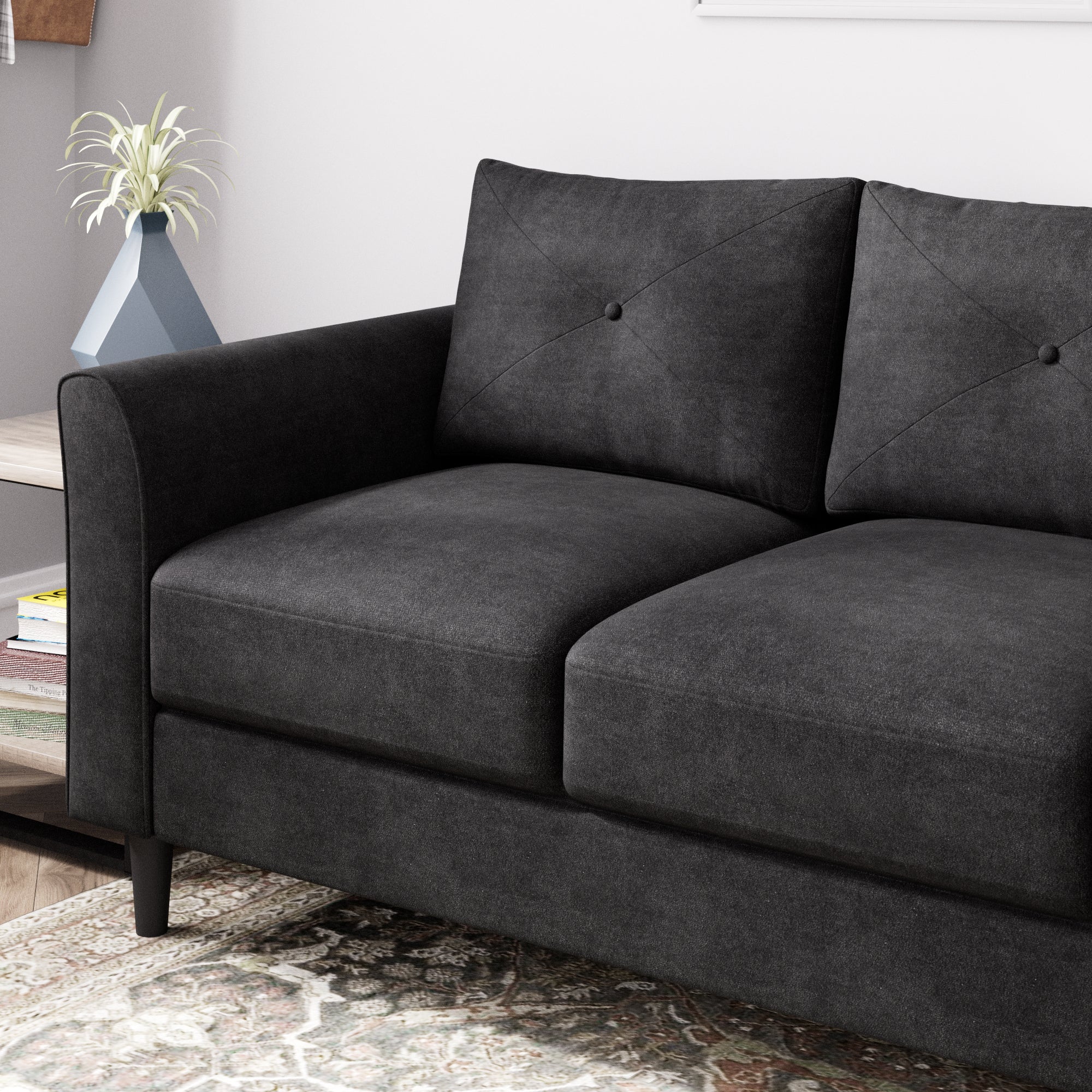 black 3 seater sofa with button tufting