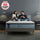 Men’s Health 2024 Sleep Awards badge with couple sitting on Zinus Ultra Cooling Green Tea Hybrid mattress in a modern bedroom, smiling and relaxing with mugs and blanket, highlighting recognition for supportive comfort and award-winning sleep innovation.