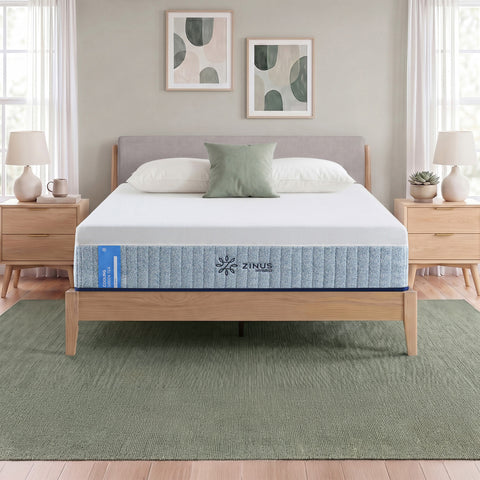 Zinus Cooling Green Tea Hybrid Mattress, Queen, staged on wood platform bed frame in bedroom with white pillows, sage cushion, and side label text reading cooling green tea hybrid.