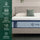 Zinus Ultra Cooling Green Tea Hybrid Mattress, Queen, on upholstered bed frame with white pillows and sage cushion, side icons reading 4X cooling, customized support, targeted pressure relief, all-night freshness, and breathable soft cover.