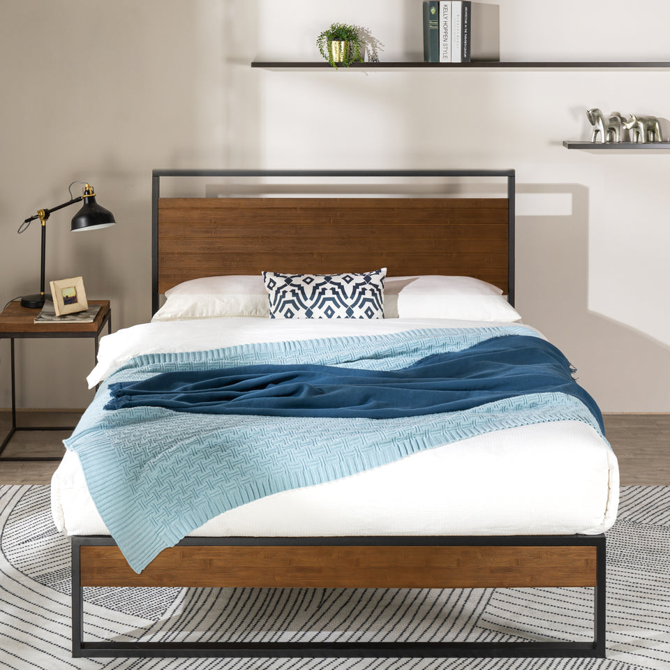 Zinus Suzanne Metal and Bamboo Platform Bed Frame with natural bamboo headboard and footboard framed in black steel. Styled in a cozy modern bedroom, this platform bed combines sturdy mattress support with contemporary industrial design.