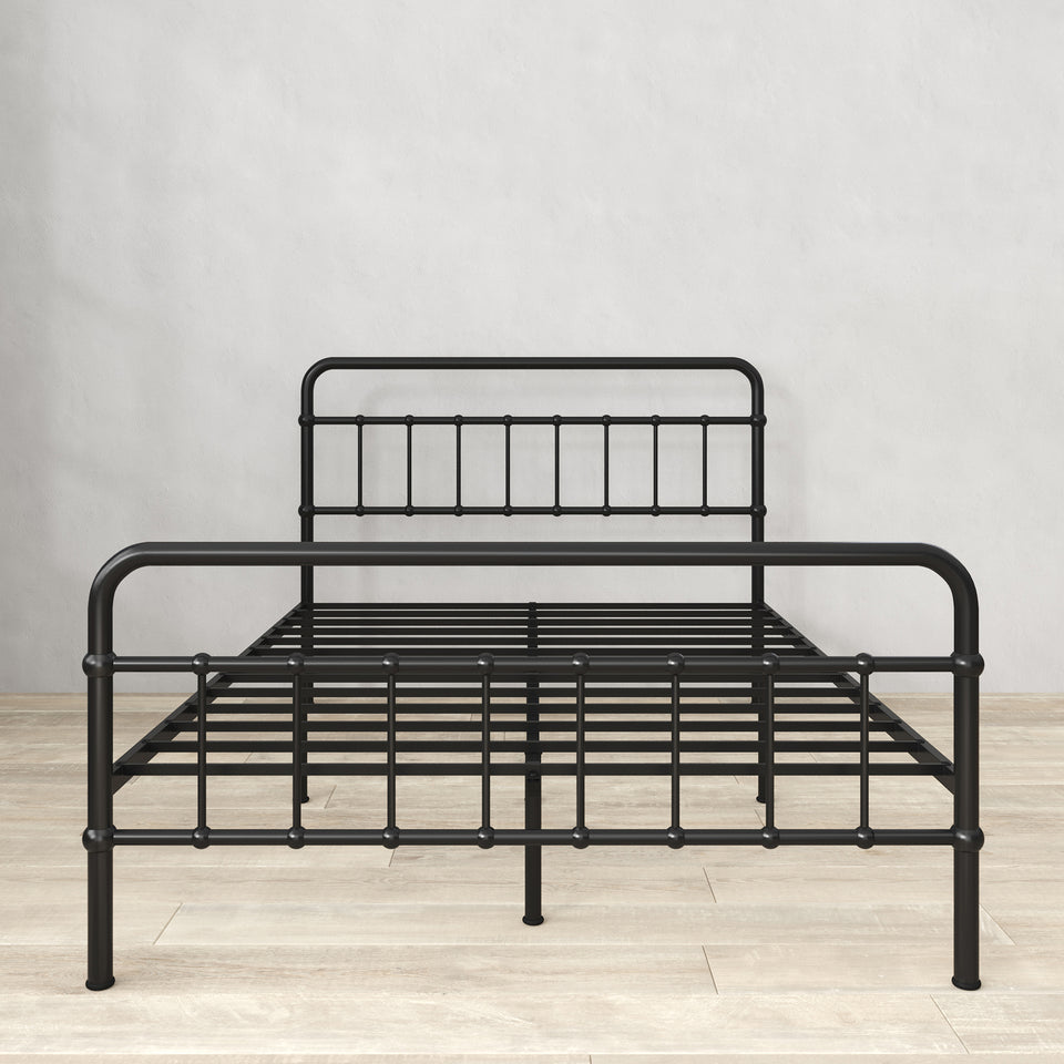 Front view of Zinus metal platform bed frame with headboard and footboard, shown in black steel. Clean lines and durable slats create a supportive base for queen or full mattresses. Functional design eliminates need for box spring while maximizing durability and mattress life.
