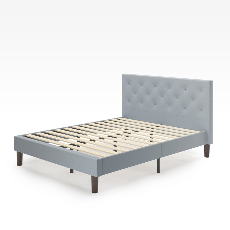Zinus Shalini Upholstered Platform Bed Frame in light gray finish with diamond-stitched tufted headboard. Features durable wooden slats for mattress support, sturdy legs, and modern low-profile design that complements contemporary and minimalist bedroom styles.