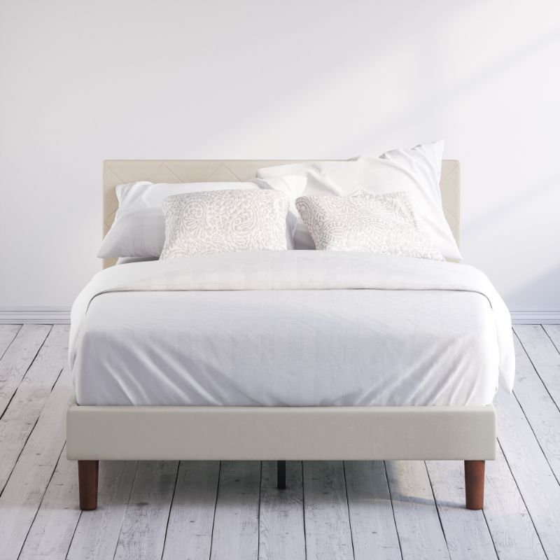 Zinus Shalini Upholstered Platform Bed Frame styled with white bedding in a minimal bedroom. The diamond-stitched headboard in dark gray fabric adds sophistication, while durable slats provide strong mattress support without the need for a box spring