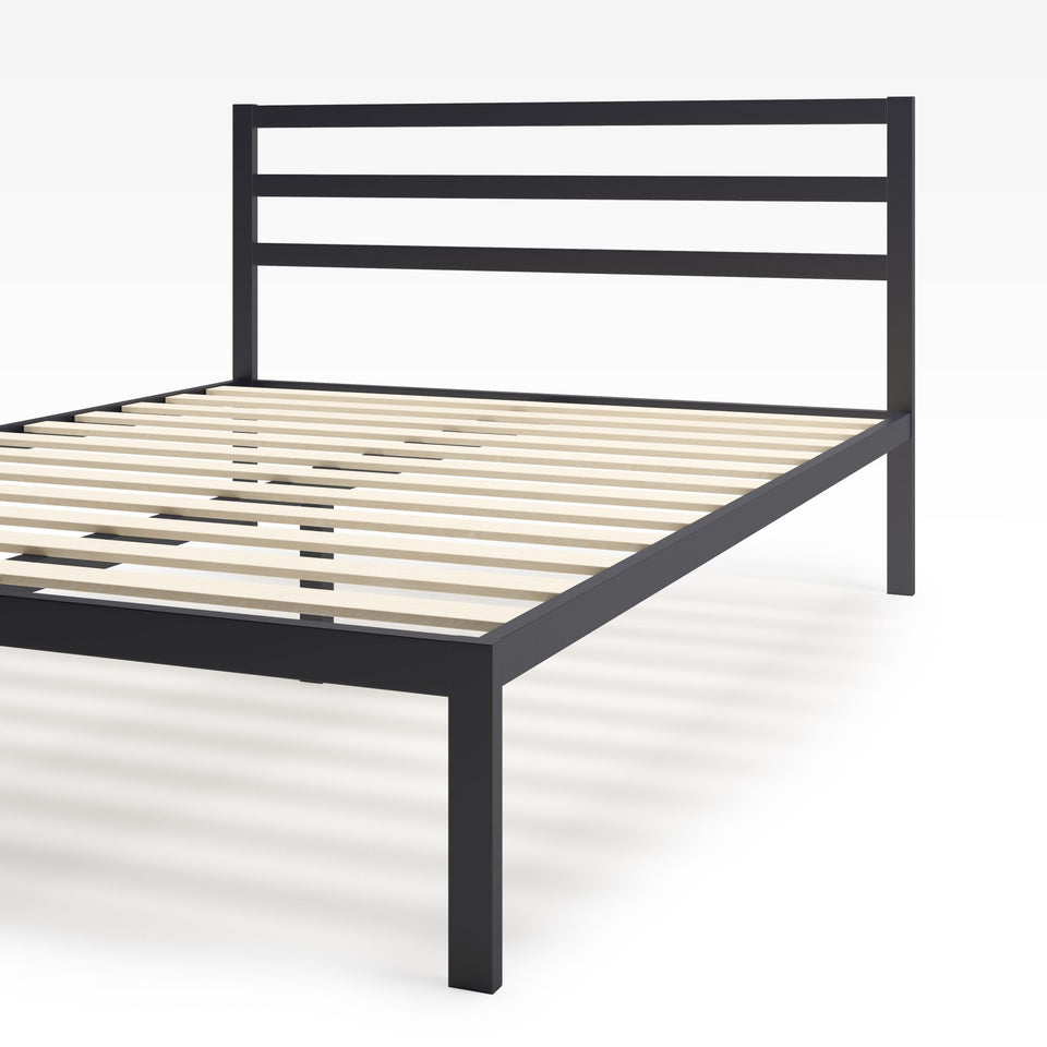 Angled close-up of Zinus Mia Metal Platform Bed Frame with Headboard. Black steel frame with horizontal slat design, wooden mattress support slats, and sturdy legs. Built for durability, minimalist appeal, and underbed storage convenience.