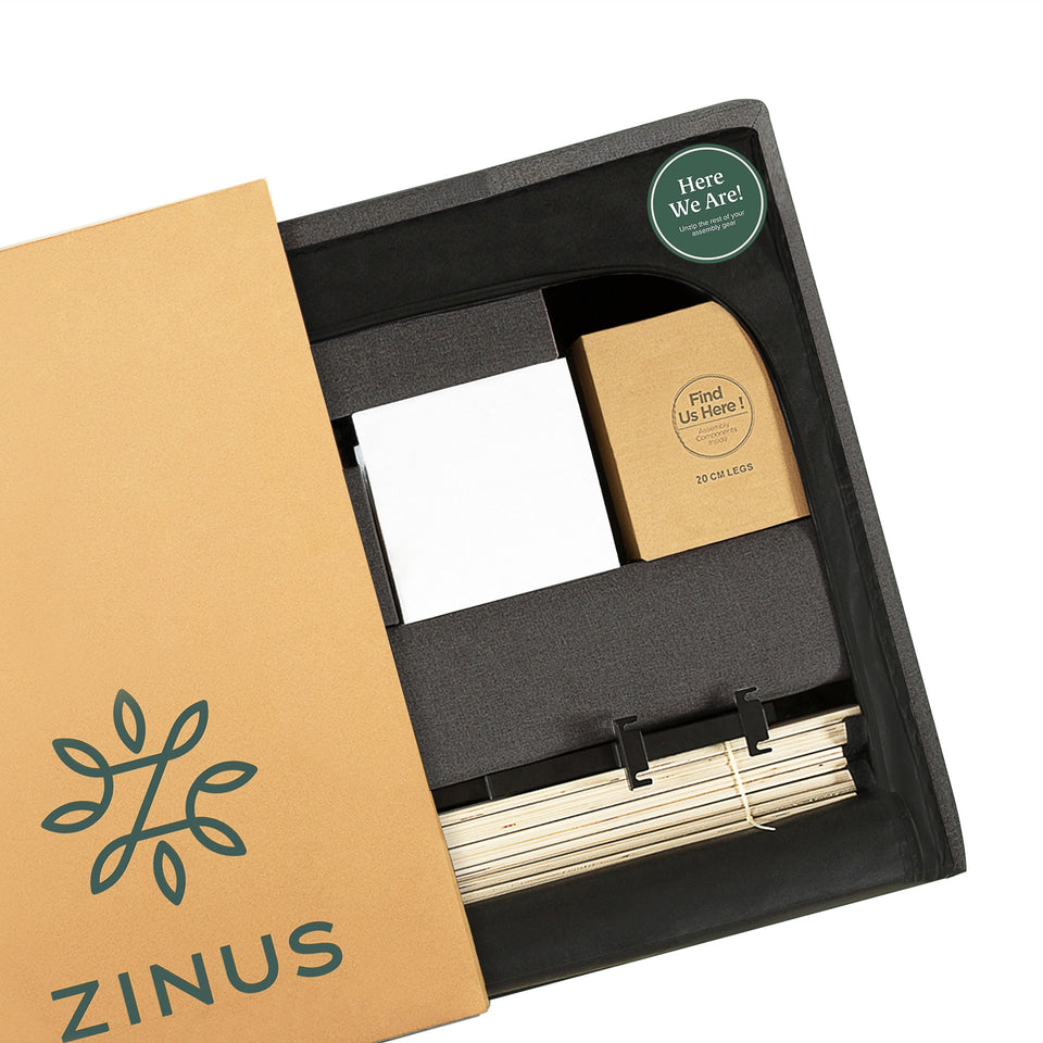 Unboxing view of Zinus Upholstered Platform Bed Frame showing neatly packed slats, legs, and hardware in compact box. Smart packaging ensures easy assembly and all components organized, highlighting Zinus innovation in delivering durable, stylish, and convenient bedroom furniture.